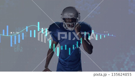 Shouting football player in helmet raising fist in studio, with candlestick line overlay Shouting football player in helmet raising fist in studio, with candlestick line overlay 135624855