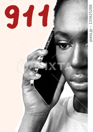 Young person making an emergency call to 911 in a serious situation 135625266