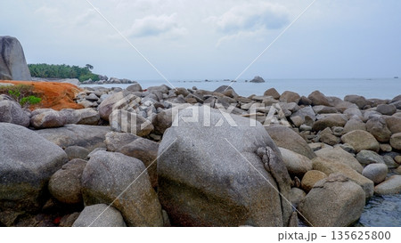 Scenic Tropical Beach Landscape with Giant Rocks and Red Soil Cliffs 135625800
