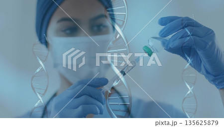 Lab tech wearing mask gloves drawing liquid from vial preparing syringe in lab, with DNA graphics Lab tech wearing mask gloves drawing liquid from vial preparing syringe in lab, with DNA graphics 135625879