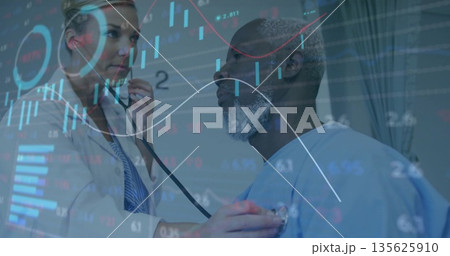 Doctor in lab coat placing stethoscope on patient in hospital gown in clinic, with digital overlays 135625910