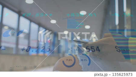 Scrolling person in denim jeans using smartphone at airport lounge, with chart overlays, copy space Scrolling person in denim jeans using smartphone at airport lounge, with chart overlays, copy space 135625973