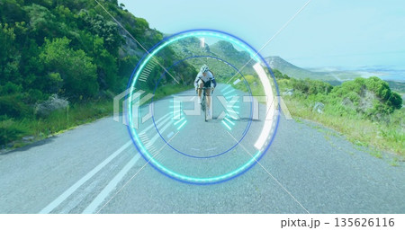Riding cyclist pedaling along mountain road wearing full cycling gear, road bike, heads-up overlay Riding cyclist pedaling along mountain road wearing full cycling gear, road bike, heads-up overlay 135626116