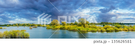 Panoramic View Countryside Landscape During Spring Flood Floodwaters. Tranquil Bold Bright Blue Sky Above Nature Landscape During Spring Flood. Amazing Reflections In River. Musical Calmness Concept 135626581