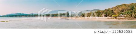 Canacona, Goa, India. Sunny Sky Over Calm Water Of Arabian Sea. Natural Landscape With Sandy Palolem Beach At Sunny Summer Day With Blue Sky Canacona, Goa, India. Sunny Sky Over Calm Water Of Arabian Sea. Natural Landscape With Sandy Palolem Beach At Sunny Summer Day With Blue Sky 135626582