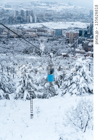 Tbilisi Aerial View with Blue Cable Car over Snowy Landscape 135626818