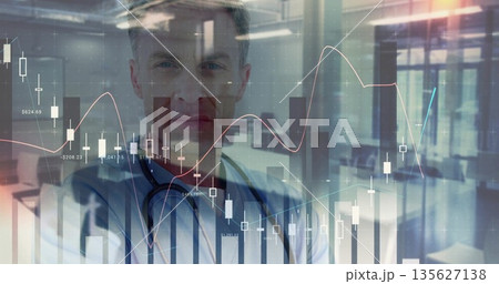Doctor wearing coat and stethoscope analyzing finance charts in hospital lobby, with chart overlay Doctor wearing coat and stethoscope analyzing finance charts in hospital lobby, with chart overlay 135627138