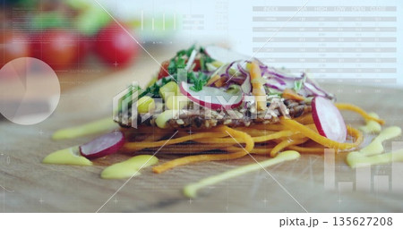 Displaying multigrain crispbread topped with veggies and sauce on wooden board with chart overlays Displaying multigrain crispbread topped with veggies and sauce on wooden board with chart overlays 135627208