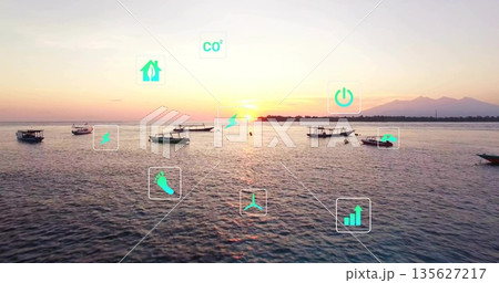 Floating small motorboats anchored on coastal bay water at sunset, with overlay green-tinged icons 135627217