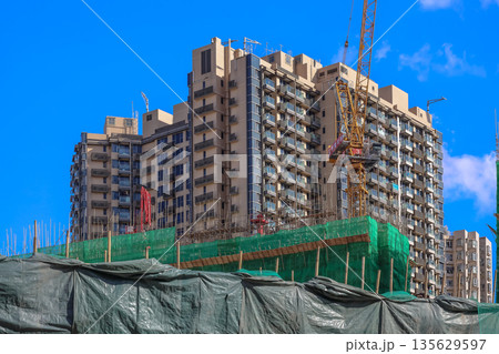 Sept 14 2025 High-Rise Residential Building Under Construction with Cranes and Blue Sky Sept 14 2025 High-Rise Residential Building Under Construction with Cranes and Blue Sky 135629597