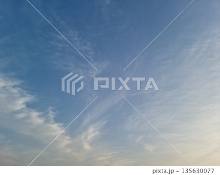 It's a sunset sky with fluffy clouds. 135630077