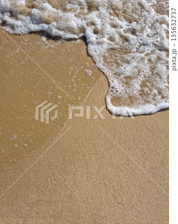 It is a sandy beach with waves rolling in. It is a sandy beach with waves rolling in. 135632737