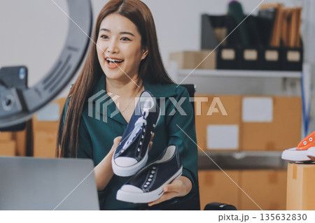 Starting small businesses SME owners female entrepreneurs check online orders to prepare to pack the boxes, sell to customers, sme business ideas online. 135632830