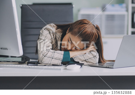 Pain, headache and stressed finance manager feeling sick, tired and worried about a financial problem at her startup company. Young and frustrated professional businesswoman working at an office Pain, headache and stressed finance manager feeling sick, tired and worried about a financial problem at her startup company. Young and frustrated professional businesswoman working at an office 135632888