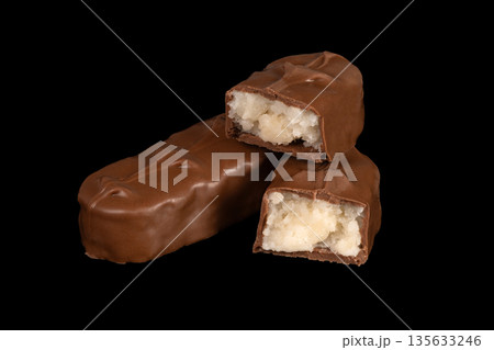 Three chocolate bars with one of them cut in half Three chocolate bars with one of them cut in half 135633246