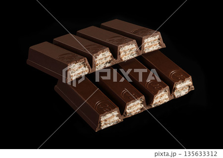 A stack of chocolate bars with the word "kix" on them A stack of chocolate bars with the word "kix" on them 135633312