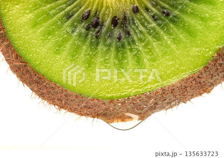 A close up of a kiwi fruit with a green and brown skin A close up of a kiwi fruit with a green and brown skin 135633723