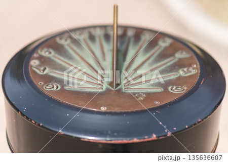 Close-Up of a Sundial with Metal Gnomon Close-Up of a Sundial with Metal Gnomon 135636607