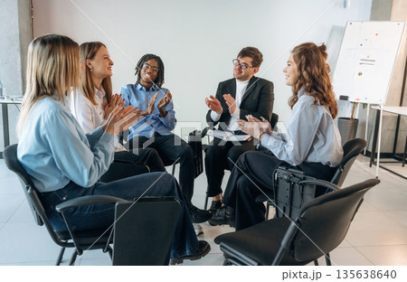 Applauding together. People are in group psychological support room Applauding together. People are in group psychological support room 135638640