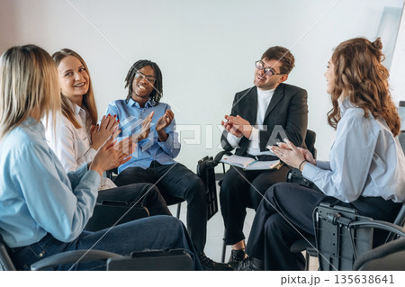 Applauding together. People are in group psychological support room Applauding together. People are in group psychological support room 135638641