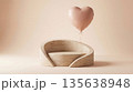 Pink heart balloon floating above a minimalist travertine product display podium 135638948