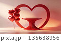Red heart arch, pedestal, and balloons on a stage for product display 135638956