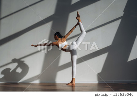 Athletic slim body type. Beautiful young woman is indoors 135639046