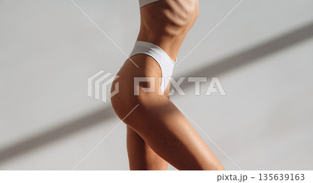 Diet conception. Close up view of woman with slim body type indoors 135639163