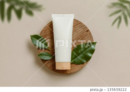 Mockup tube face cream on wooden stand with leaves, natural skin care cosmetics 135639222
