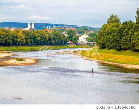 uzhhorod, ukraine - 29 jun, 2007: river uzh on a summer day. uzhhorod city travel background. panoramic view of a historic cityscape with bridge over water. urban landscape of old town in euroope 135640566