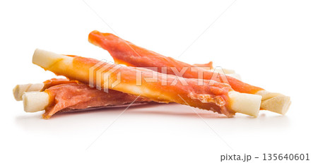Dog food. Snack sticks for dogs isolated on white background. Dog food. Snack sticks for dogs isolated on white background. 135640601