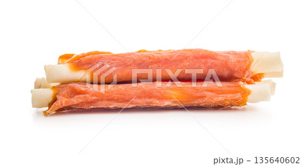 Dog food. Snack sticks for dogs isolated on white background. Dog food. Snack sticks for dogs isolated on white background. 135640602