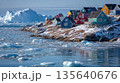 Polar Village with Bright Houses and Floating Icebergs 135640676