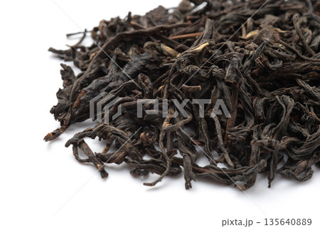 Pile of black tea on white background. 135640889