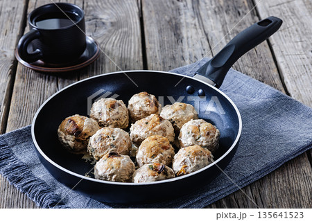 fried chicken meatballs in a skillet, close-up fried chicken meatballs in a skillet, close-up 135641523