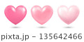 A set of three three-dimensional pink hearts with highlights and shadows on a white background. Heart icons for your design. 135642466