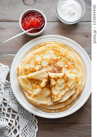 Homemade thin crepes with red caviar Homemade thin crepes with red caviar 135643440