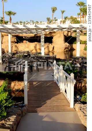 A beautiful wooden staircase in an outdoor restaurant A beautiful wooden staircase in an outdoor restaurant 135643497