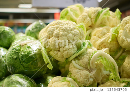 Exploring fresh vegetables at a local market during the morning hours in vibrant city life Exploring fresh vegetables at a local market during the morning hours in vibrant city life 135643796