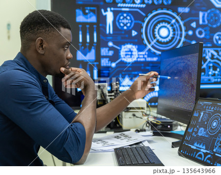 Black Researcher Making a Quantum Computing Experiment 135643966