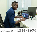 Black Researcher Making a Quantum Computing Experiment 135643970