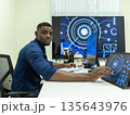 Black Researcher Making a Quantum Computing Experiment 135643976