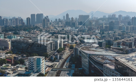 Jan 15 2026 Bright Daylight Illuminates Busy Kowloon Tong Train Station Surroundings 135644161