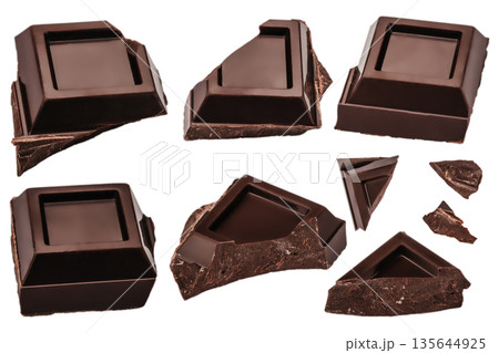 Broken dark chocolate pieces isolated on white background 135644925