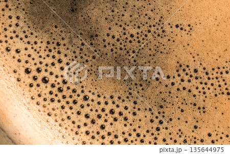 Coffee foam bubbles macro texture background Coffee foam bubbles macro texture background 135644975