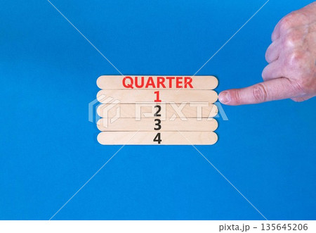 1st first quarter 1 symbol. Concept word Quarter 1 on beautiful wooden sticks. Beautiful blue background. Businessman's hand. Business, happy 1st first quarter 1 Q1 concept. Copy space. 1st first quarter 1 symbol. Concept word Quarter 1 on beautiful wooden sticks. Beautiful blue background. Businessman's hand. Business, happy 1st first quarter 1 Q1 concept. Copy space. 135645206