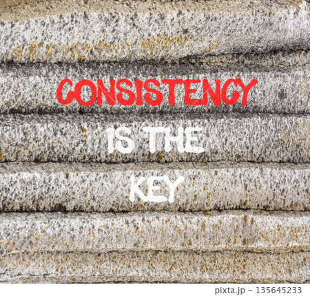 Consistency is the key symbol. Concept words Consistency is the key on beautiful grey mountain. Beautiful grey mountain background. Business consistency is the key concept. Copy space. Consistency is the key symbol. Concept words Consistency is the key on beautiful grey mountain. Beautiful grey mountain background. Business consistency is the key concept. Copy space. 135645233