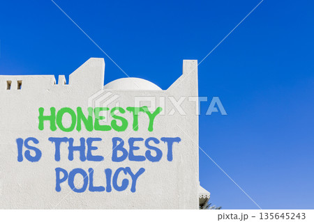Honesty is the best policy symbol. Concept words Honesty is the best policy on beautiful white wall. Beautiful blue sky background. Business honesty is the best policy concept. Copy space. Honesty is the best policy symbol. Concept words Honesty is the best policy on beautiful white wall. Beautiful blue sky background. Business honesty is the best policy concept. Copy space. 135645243