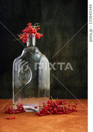 Still-life with viburnum red and empty glass bottle Still-life with viburnum red and empty glass bottle 135645349