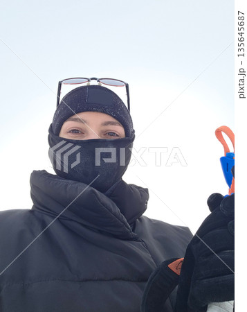 Winter Selfie of woman with Skis and Poles Ready Winter Selfie of woman with Skis and Poles Ready 135645687